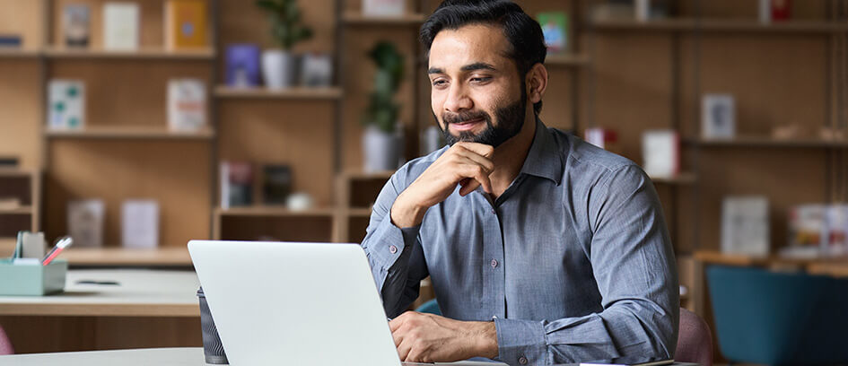 Man watching Virtual Visiting on a laptop.