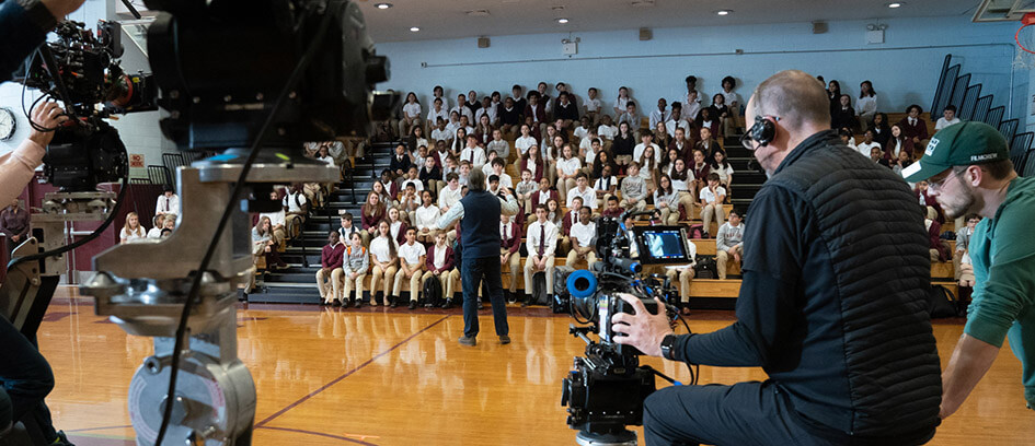 Camera crew filming Background Actors.