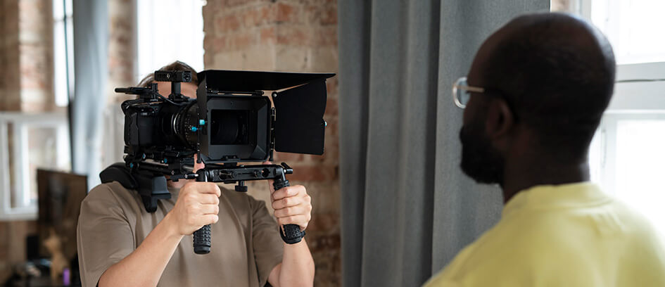 Cameraman and movie Stand-In on set.