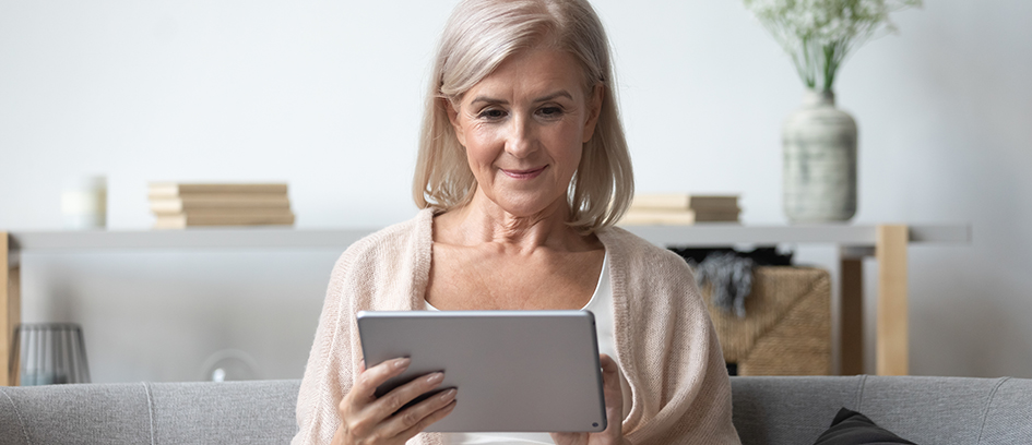 Woman submitting for work on a tablet.