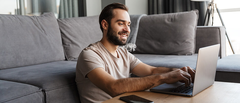 Man updating his union status on a laptop.